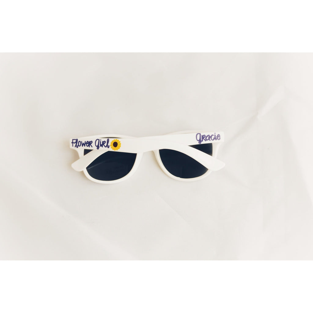 White youth sunglasses with flower girl text on the arms