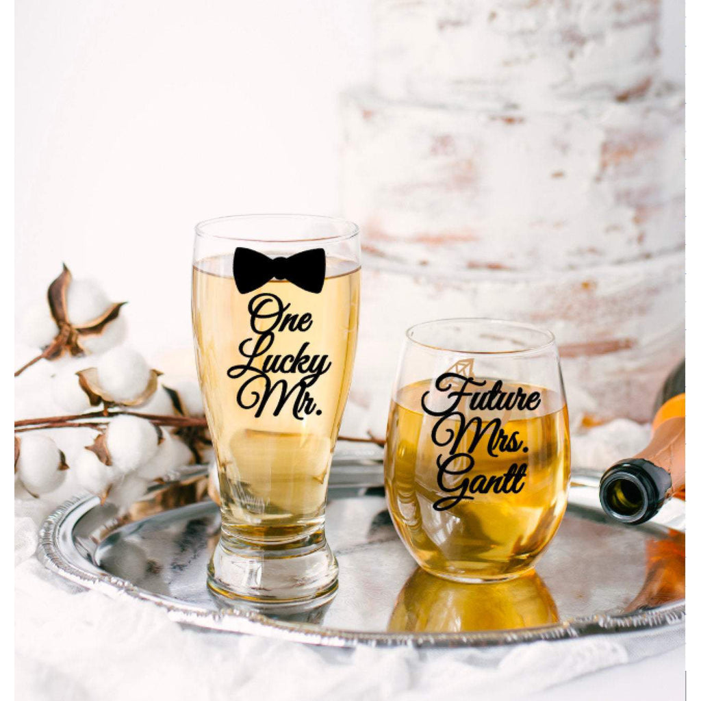 one lucky mr and bow tie with black text and future mrs stemless wine glass